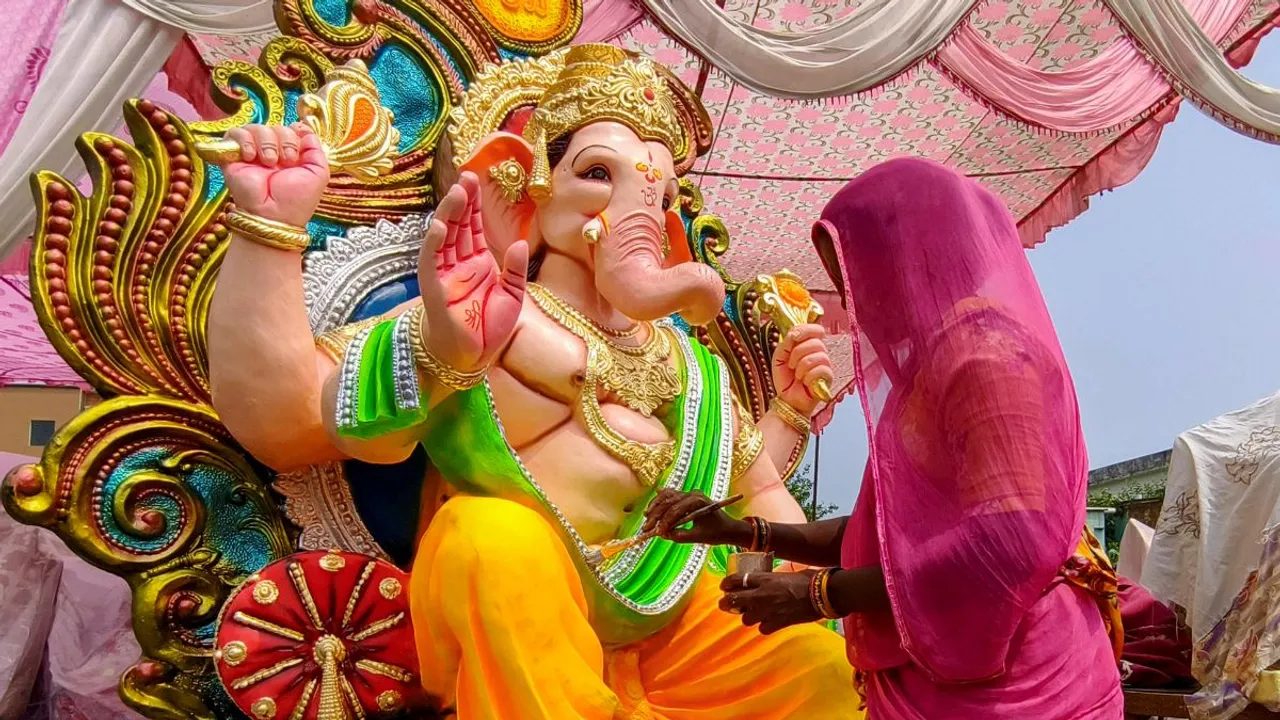 An artisan gives final touches to an idol of Lord Ganesh ahead of the Ganesh Chaturthi festival, in Amritsar, Thursday, Sept 5, 2024