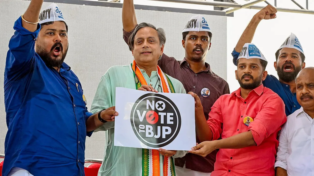 Congress leader Shashi Tharoor with Aam Aadmi Party (AAP) workers releases a logo 'No Vote to BJP' during a protest meet organised by AAP, in Thiruvananthapuram, Wednesday, March 27, 2024