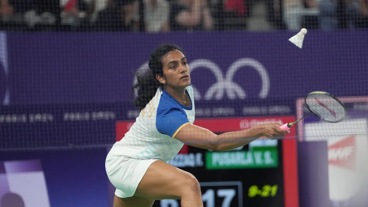 India's PV Sindhu returns a shot during the Women's Singles Group play stage badminton match at the Summer Olympics 2024, in Paris, Sunday, July 28, 2024.