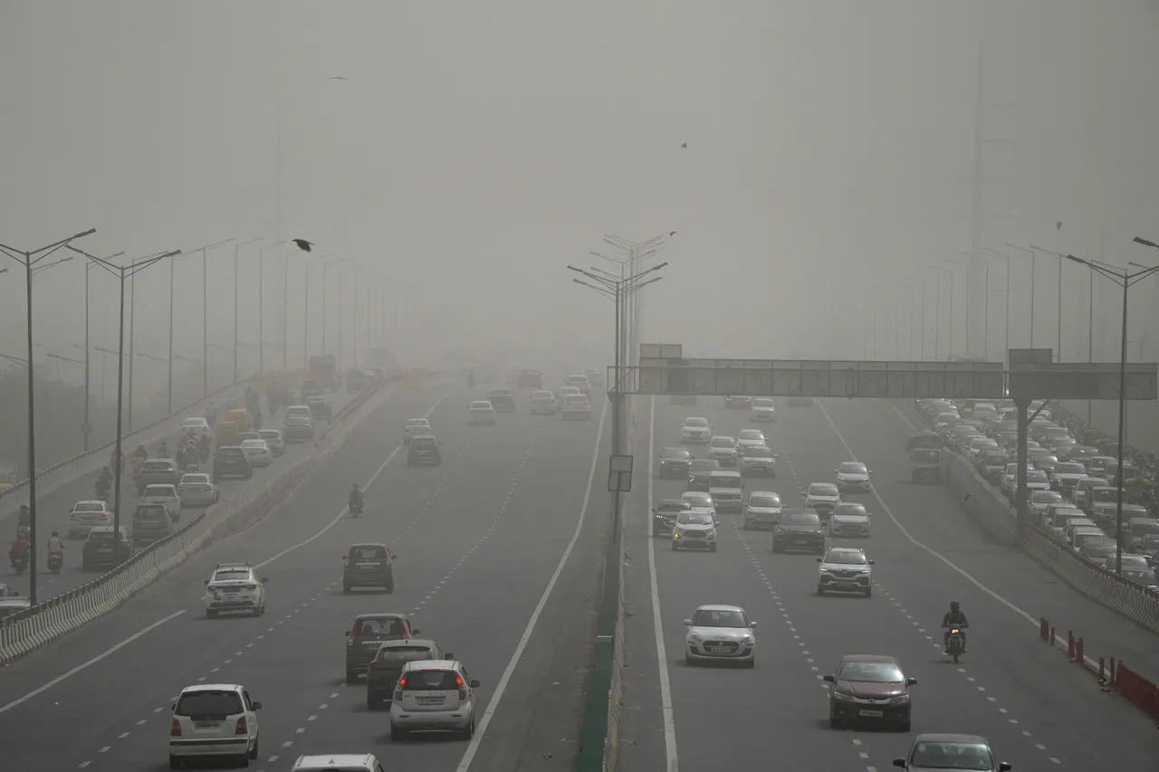Vehicles ply on a road as the air quality deteriorates due to dust pollution, in New Delhi, Tuesday morning