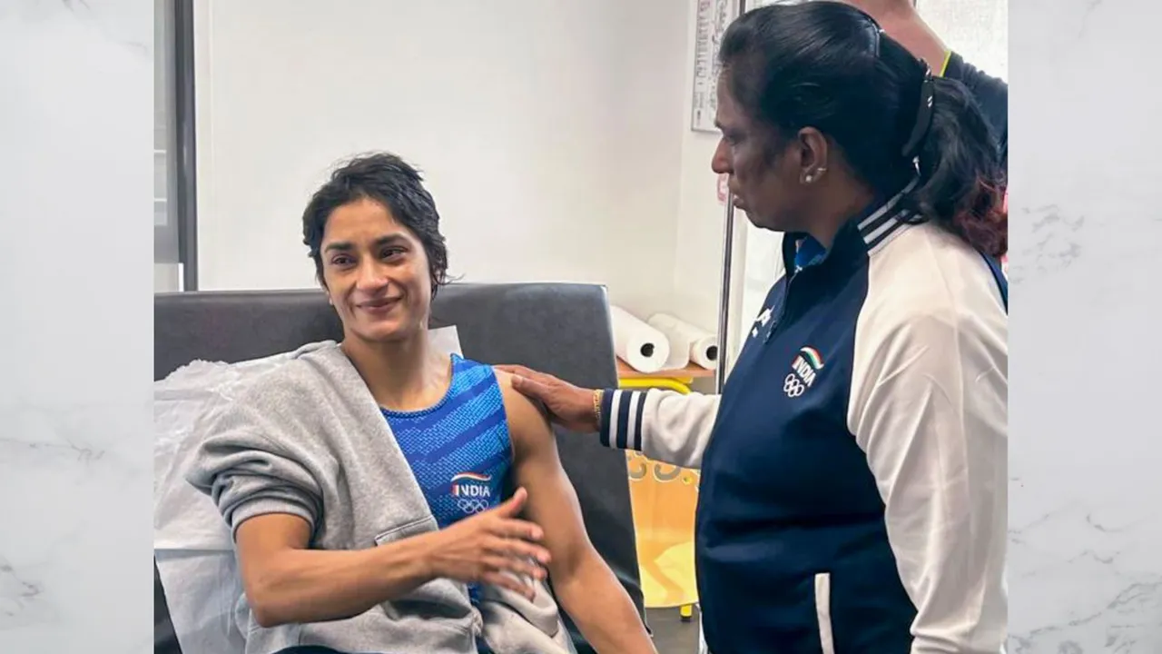 Wrestler Vinesh Phogat with Indian Olympics Association (IOA) President PT Usha