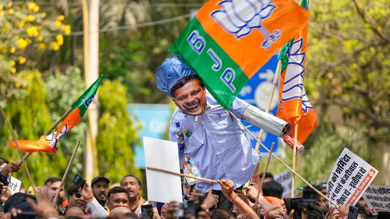 BJP workers stage a protest against AAP convener and Delhi CM Arvind Kejriwal, outside AAP office in New Delhi, Wednesday, April 10, 2024