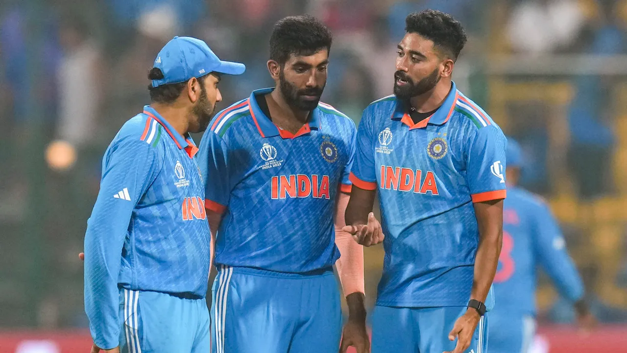 Mohammed Siraj with Jasprit Bumrah and captain Rohit Sharma celebrates the wicket of Netherlands' Sybrand Engelbrecht during the ICC Men's Cricket World Cup match between India and Netherlands, at M Chinnaswamy Stadium in Bengaluru, Sunday, Nov. 12, 2023