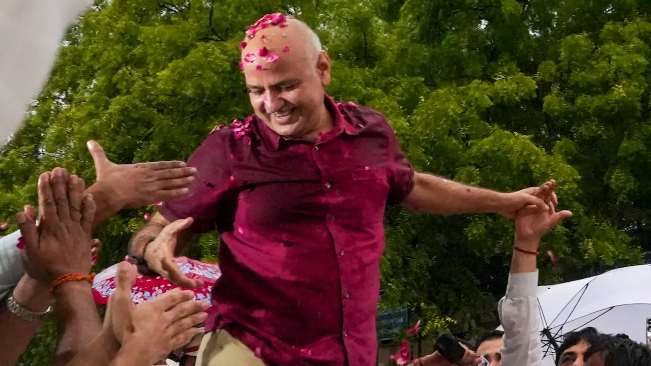 AAP leader Manish Sisodia greets supporters after being released from the Tihar Jail following his bail granted by the Supreme Court in corruption and money laundering cases linked to the Delhi excise policy scam case, in New Delhi, Friday, Aug. 9, 2024.