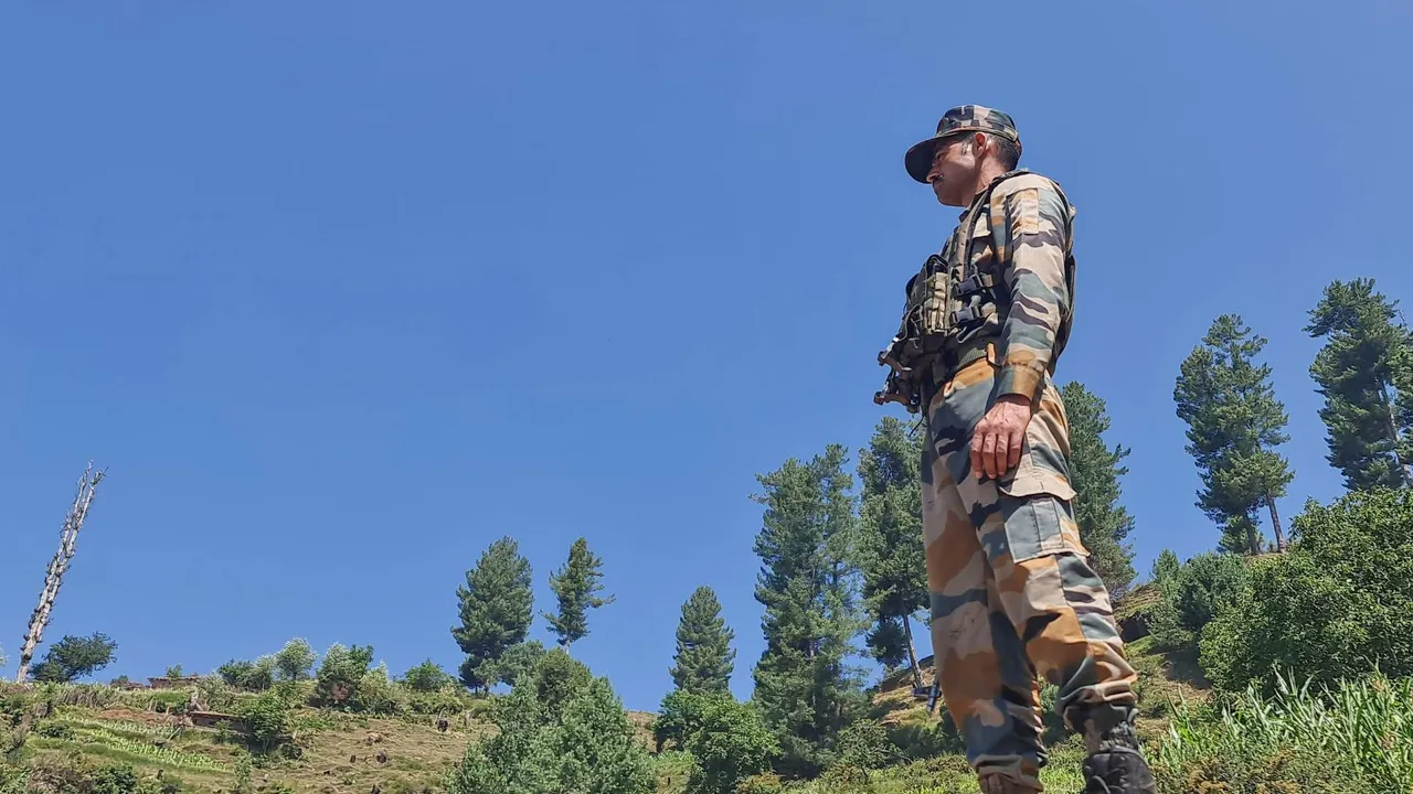 A security personnel stands guard during an anti-terror operation after four Army personnel, including an officer, died after being injured in a gunfight with terrorists, in Doda district of Jammu and Kashmir, Tuesday, July 16, 2024.