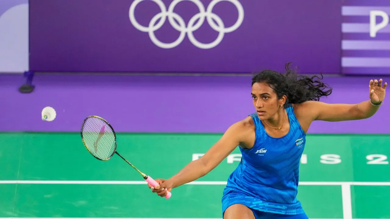India's PV Sindhu returns to Estonia's Kristin Kuuba during the women's singles group play stage badminton match at the 2024 Summer Olympics, in Paris, France, Wednesday, July 31, 2024.