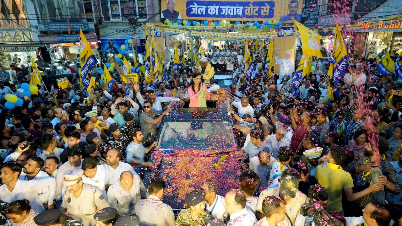 Jailed Delhi Chief Minister Arvind Kejriwal's wife Sunita Kejriwal greets supporters during an election roadshow in support of Aam Aadmi Party's (AAP) candidate from West Delhi constituency Mahabal Mishra for the Lok Sabha polls, in New Delhi.