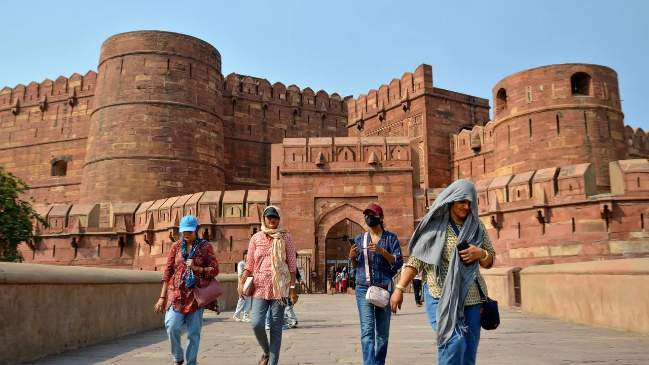 Visitors at the Agra Fort on a hot summer day, in Agra, Thursday, May 16, 2024