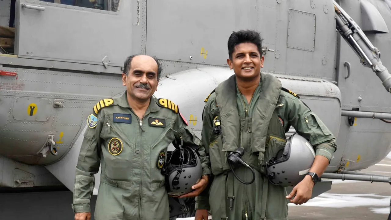Navy pilot Lt Commander Nikhil Aher with his Sainik School senior Capt Kaustubh Gosavi near a Kamov Ka-31 helicopter. Aher flew Gosavi in the latter's last sortie a day before Capt Gosavi retired on July 31.