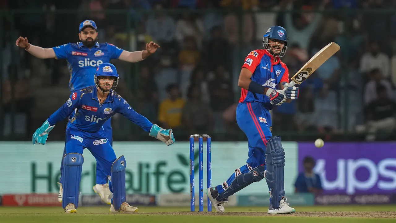 Axar Patel plays a shot during the IPL 2023 cricket match between Delhi Capitals and Mumbai Indians at the Arun Jaitley Stadium on April 11