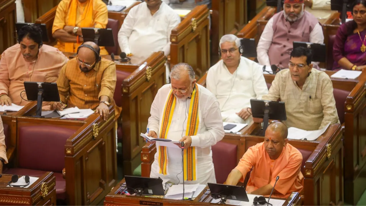 Uttar Pradesh Finance Minister Suresh Khanna with Chief Minister Yogi Adityanath during the Monsoon session of state Legislative Assembly at Vidhan Bhawan, in Lucknow, Tuesday, July 30, 2024.