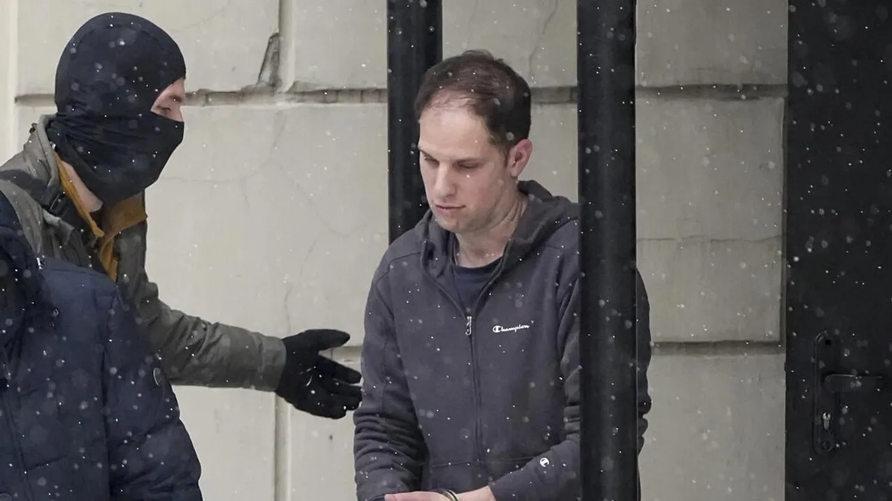 Wall Street Journal reporter Evan Gershkovich is escorted from a court hearing in Moscow, Russia, on Friday, Jan. 26, 2024. 