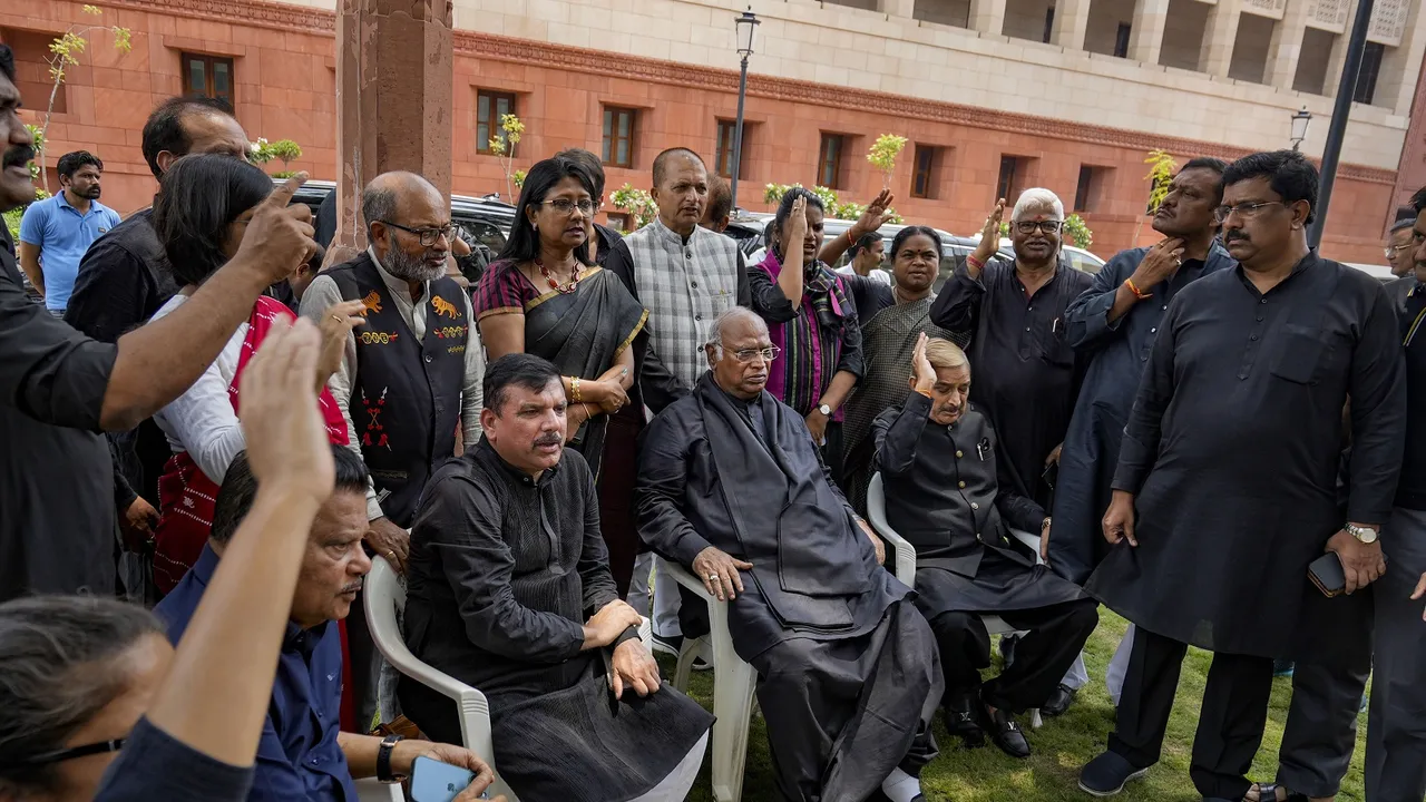 AP MP Sanjay Singh with Leader of Opposition in Rajya Sabha Mallikarjun Kharge and other opposition MPs during a protest over his suspension from Rajya Sabha