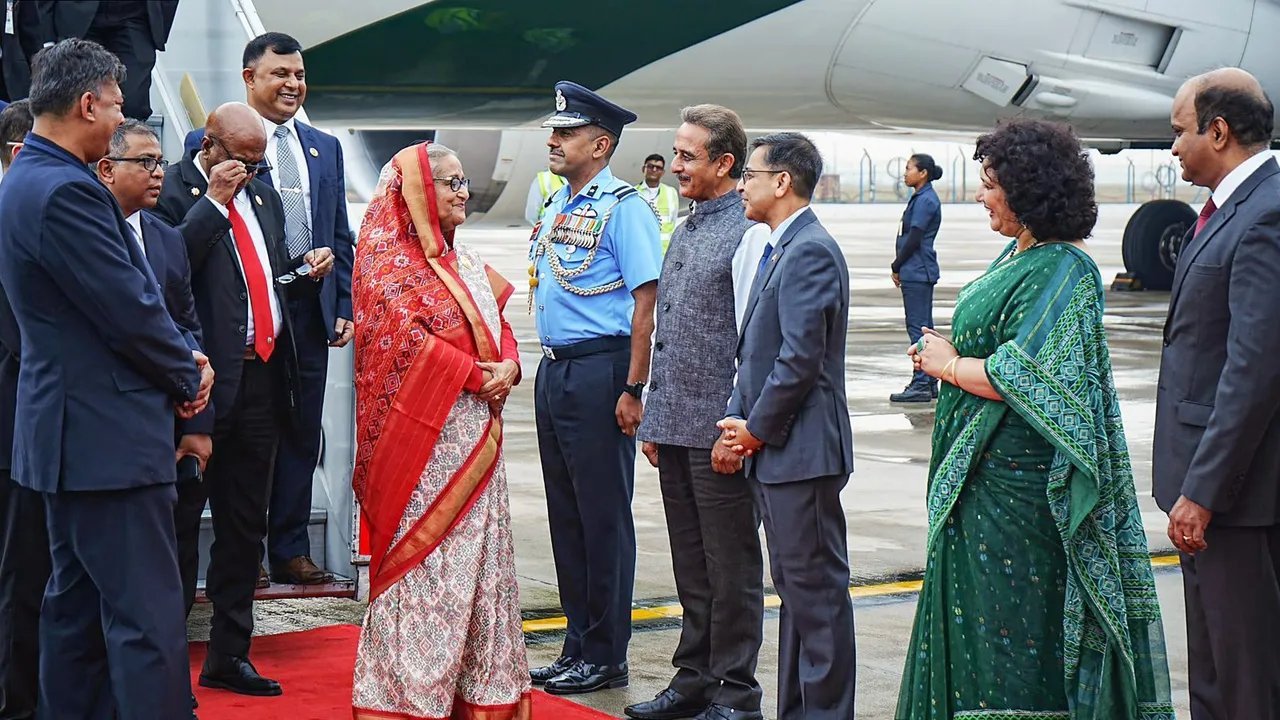 Prime Minister of Bangladesh Sheikh Hasina being welcomed by Minister of State for External Affairs Kirti Vardhan Singh upon her arrival on a two-day state visit to India, in New Delhi, Friday, June 21, 2024.