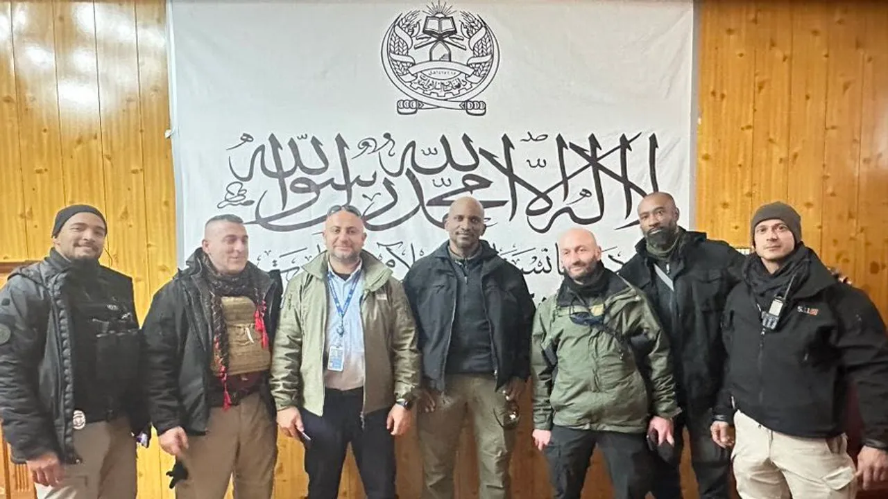 UN security personnel photo op with Taliban flag