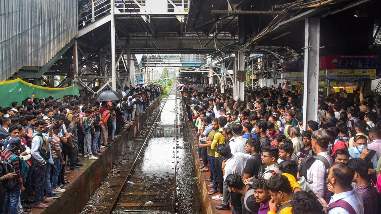 Commuters were waiting to catch a train as local train services were affected due to heavy rains