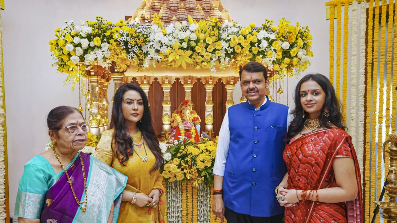 Maharashtra Deputy Chief Minister Devendra Fadnavis along with his wife Amruta Fadnavis brings an idol of Lord Ganesh on Ganesh Chaturthi festival, at his official residence in Mumbai