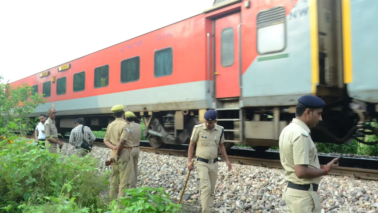 Police personnel inspect the railway track after an attempt was allegedly made to derail the Kalindi Express, heading towards Bhiwani from Prayagraj, by placing an LPG cylinder on the tracks, in the Shivrajpur area in Kanpur, on Sunday night