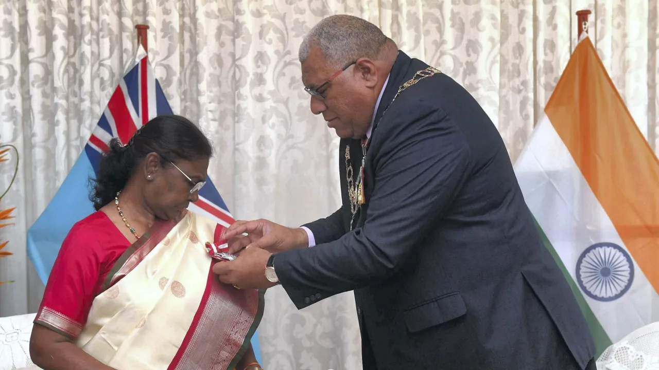 President of Fiji Ratu Wiliame Maivalili Katonivere confers the Companion of the Order of Fiji upon President Droupadi Murmu, in Suva, Tuesday, Aug. 6, 2024.