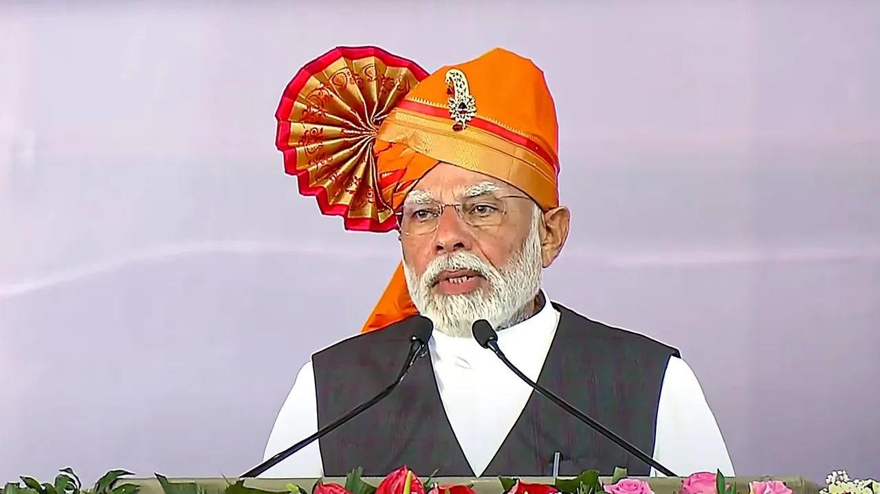 Prime Minister Narendra Modi addresses the gathering during the foundation stone laying ceremony of eight AMRUT projects, in Solapur