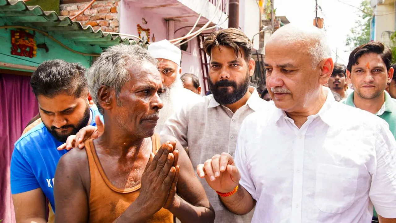 AAP leader Manish Sisodia meets people living in slums of Madras Camp, in New Delhi, Tuesday, Sept. 10, 2024.
