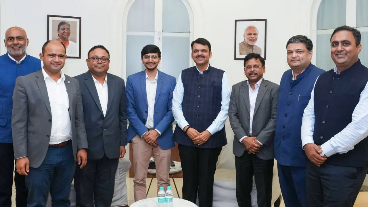 Maharashtra deputy Chief Minister Devendra Fadnavis with Ather Energy team