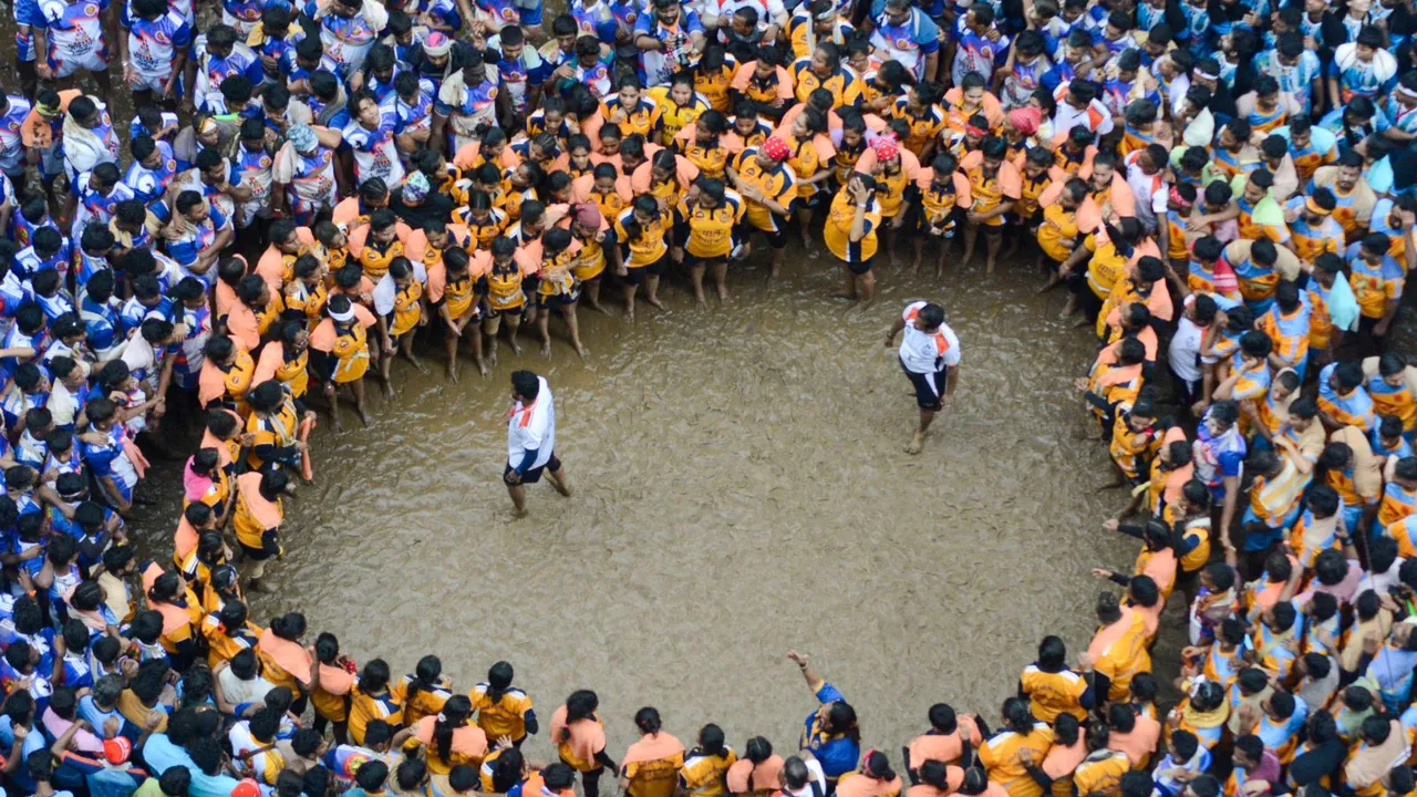 Devotees form a human pyramid to break the 'dahi handi' during Janmashtami celebrations, in Thane, Tuesday, Aug. 27, 2024.