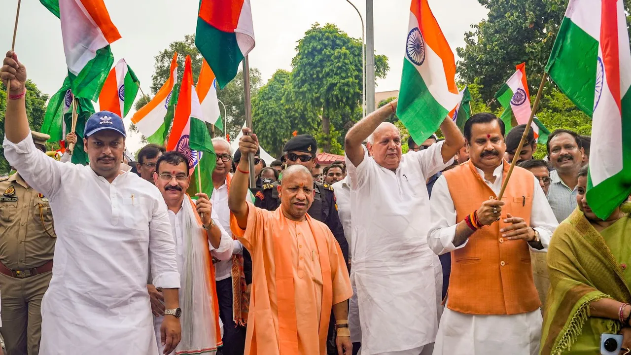 Uttar Pradesh Chief Minister Yogi Adityanath participates in a 'tiranga yatra' ahead of the Independence Day, in Lucknow, Tuesday, Aug. 13, 2024.