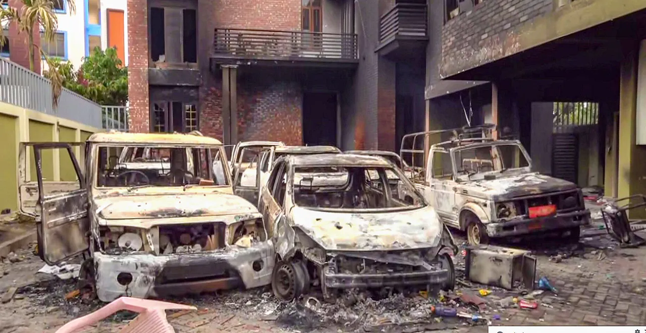 Charred vehicles which were set ablaze following tribal groups' protests over court order on Scheduled Tribe status, in Imphal, Manipur