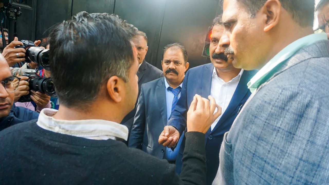  AAP leader Jasmine Shah speaks with Delhi Police Crime Branch officials who came to serve Delhi Chief Minister Arvind Kejriwal a notice regarding investigation into his claim that the BJP was trying to poach AAP MLAs, at CM's official residence in New Delhi, Saturday, Feb. 3, 2024.