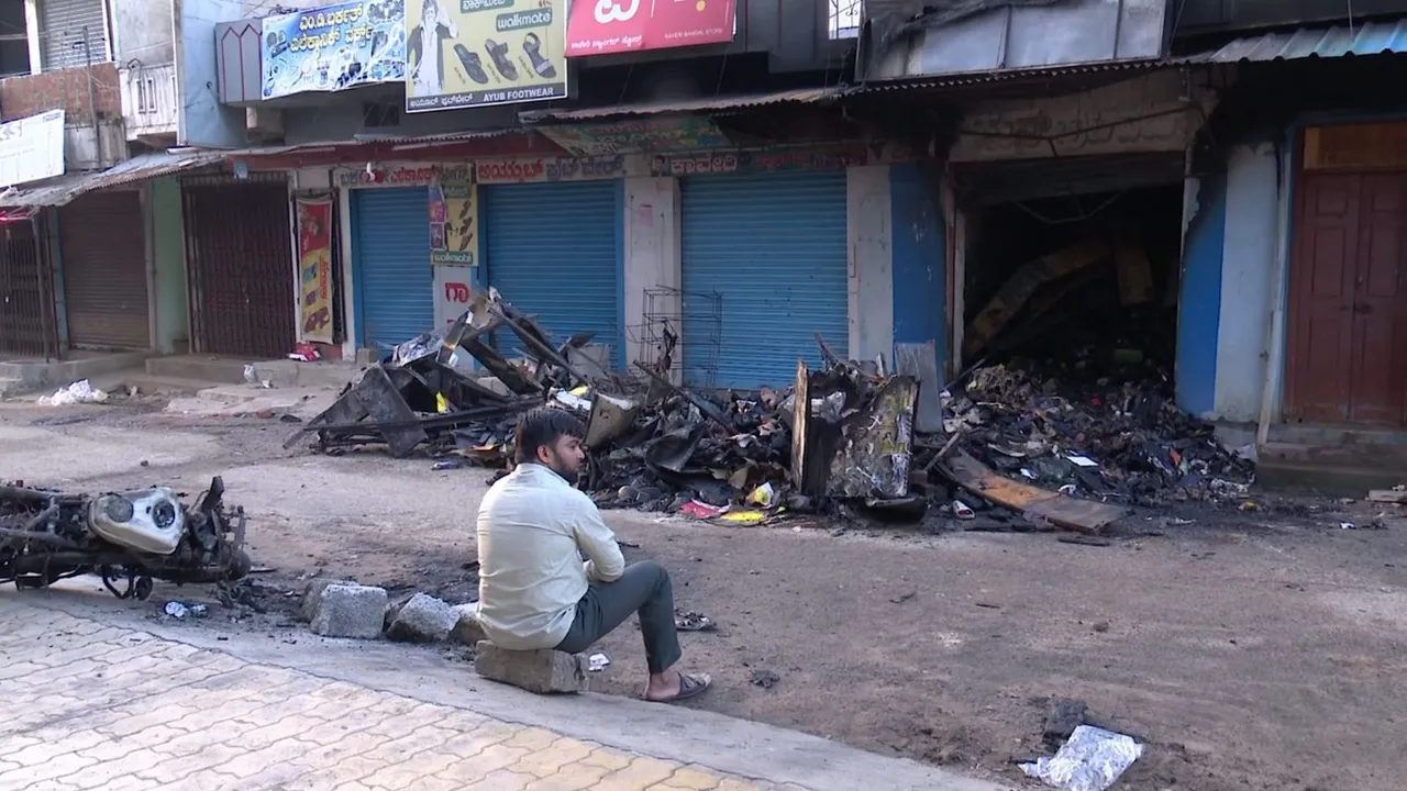 Charred remains of goods at a shop following clashes between two groups during a Ganesh Chaturthi procession, at Nagamangala in Mandya district, Thursday, Sept. 12, 2024.