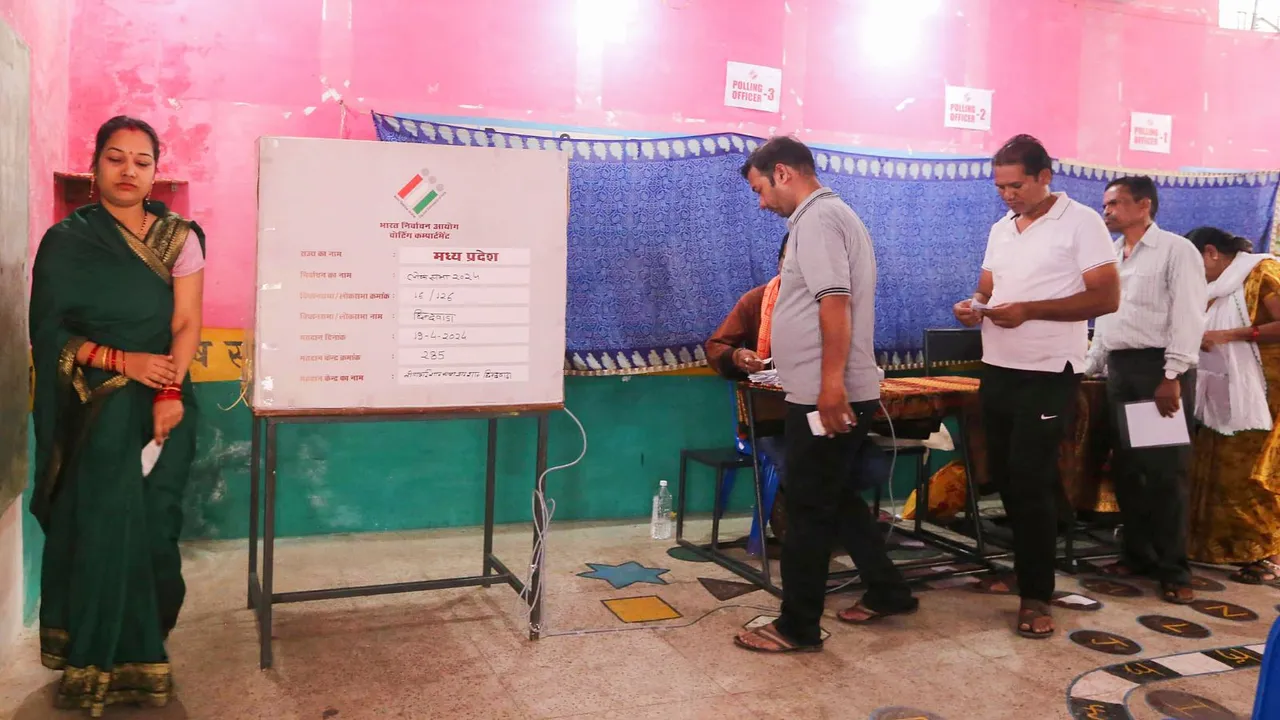Voters wait to cast their votes at a polling station during the first phase of Lok Sabha elections, in Chhindwara, Madhya Pradesh, Friday, April 19, 2024