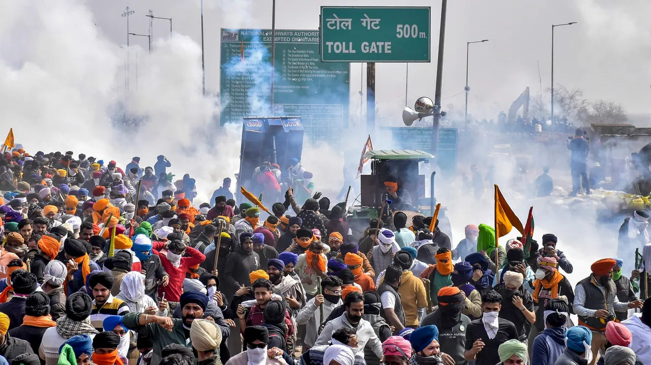 Smoke rises from tear gas being fired upon the protesting farmers during their 'Delhi Chalo' march, near the Punjab-Haryana Shambhu Border