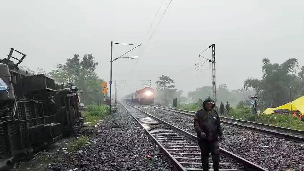 A train passes through the accident area a day after the collision between the Kanchanjunga Express and a goods train, near Rangapani railway station, Tuesday, June 18, 2024.