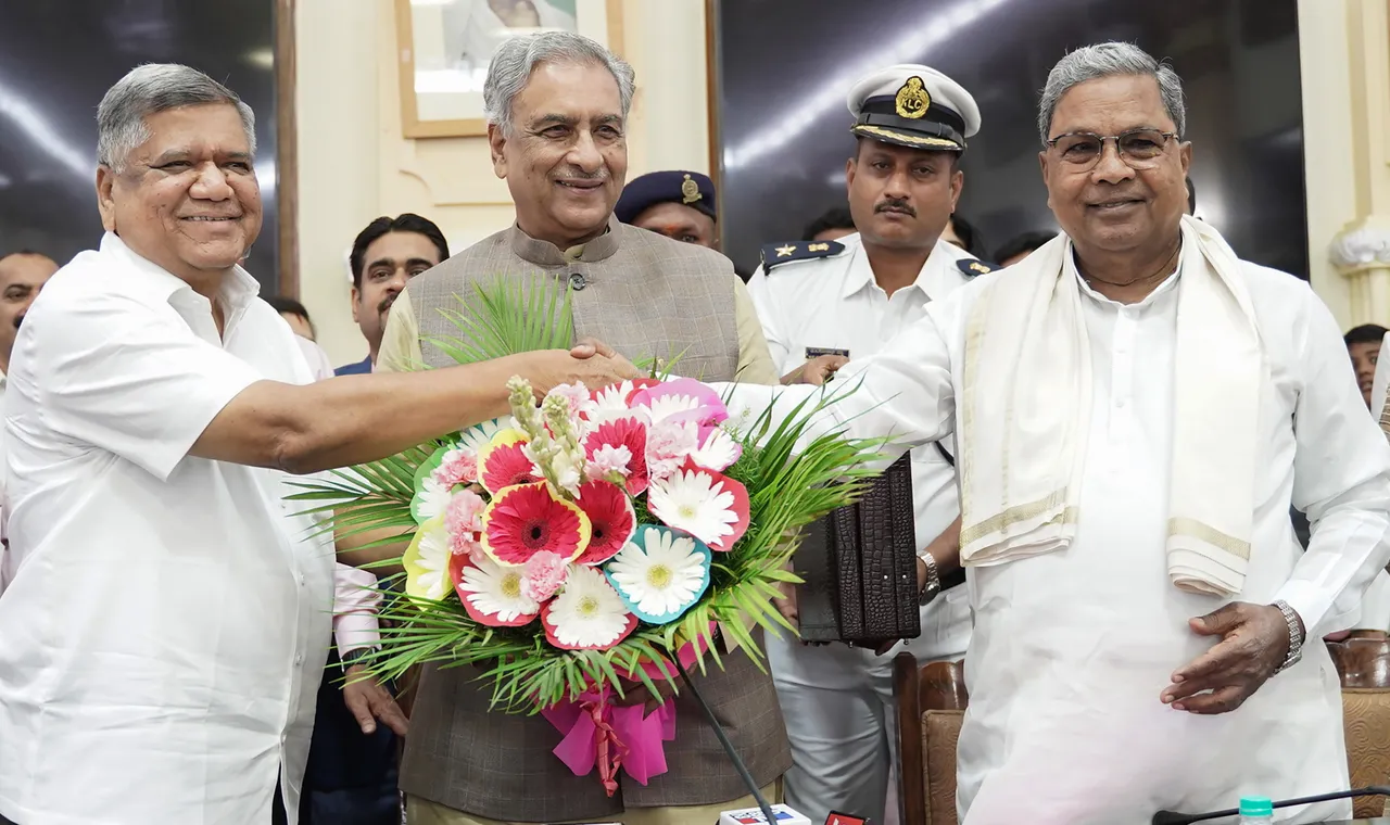 Karnataka Legislative Council Chairman Basavaraj Horatti and Karnataka Chief Minister Siddaramaiah greet newly elected Karnataka Legislative Council member Jagadish Shettar