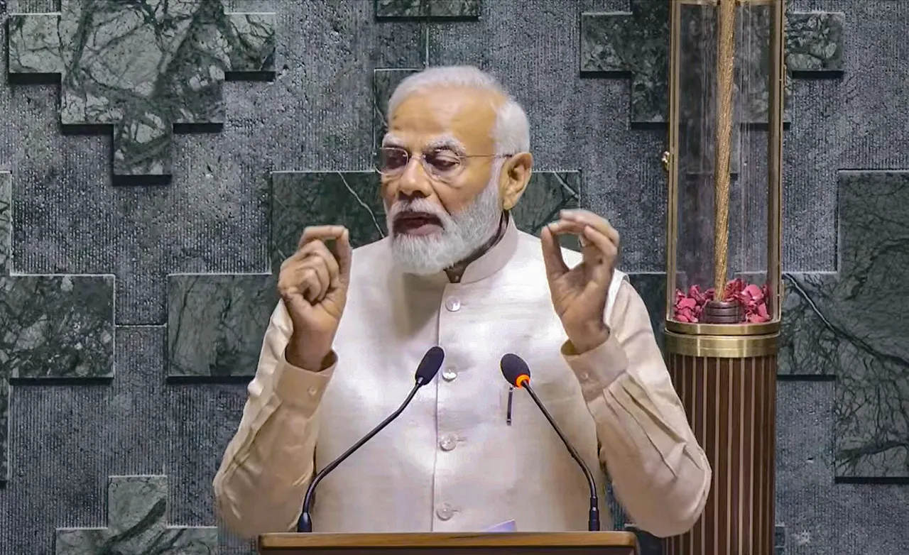 Prime Minister Narendra Modi addresses a gathering inside the Lok Sabha chamber, at the new Parliament building in New Delhi