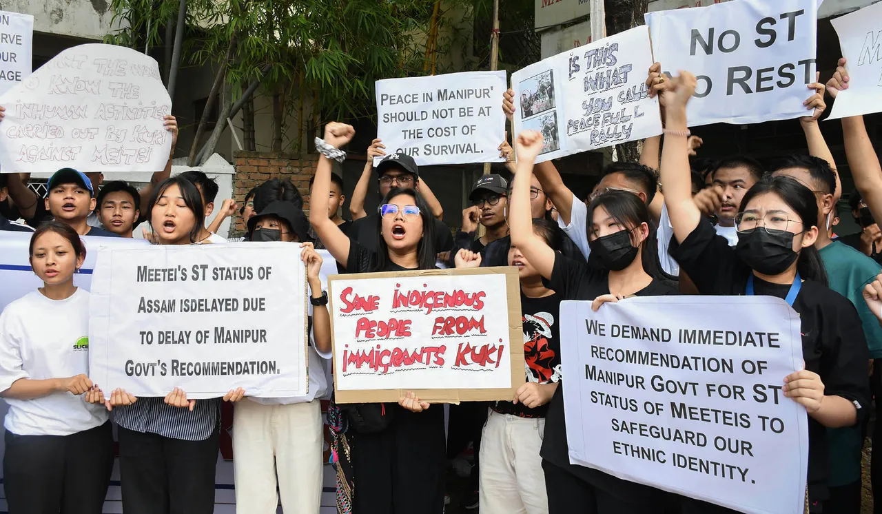 People from Manipur raise slogans during their protest against the ongoing violence in Manipur, at Manipuri Rajbari in Guwahati