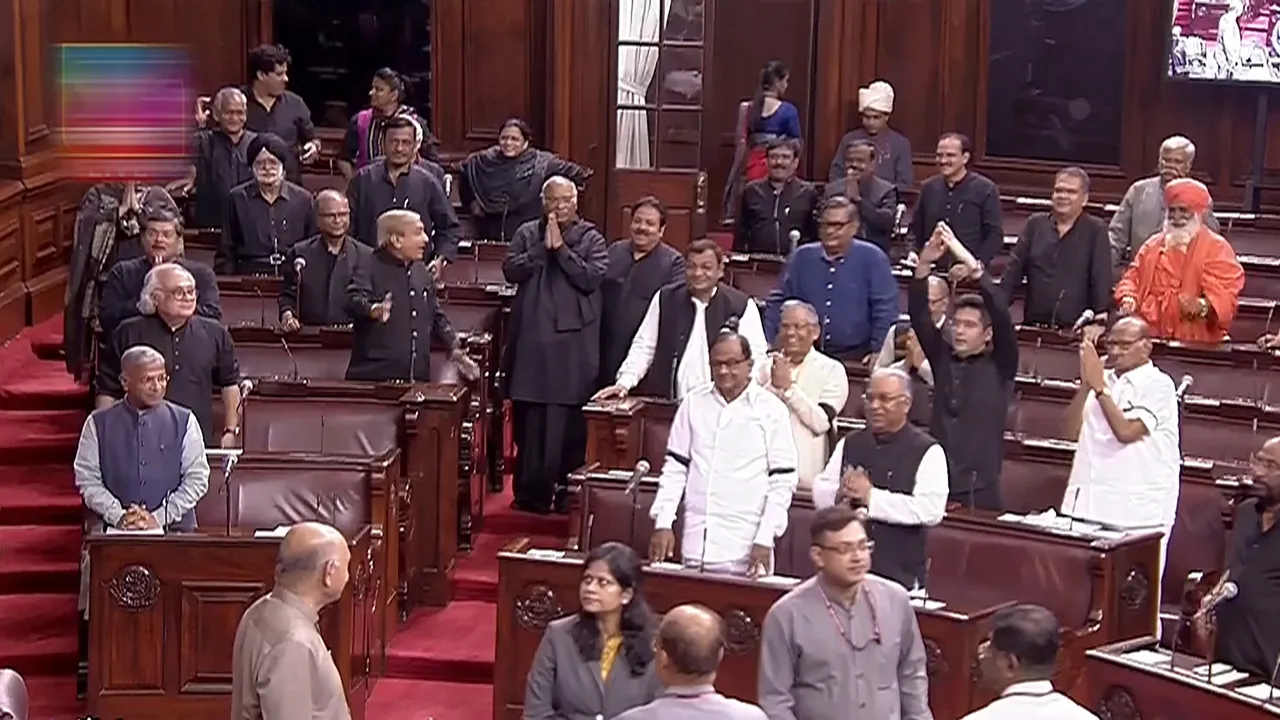 Parliamentarians welcome Rajya Sabha Chairman Jagdeep Dhankhar (unseen) in the House during the Monsoon session of Parliament, in New Delhi