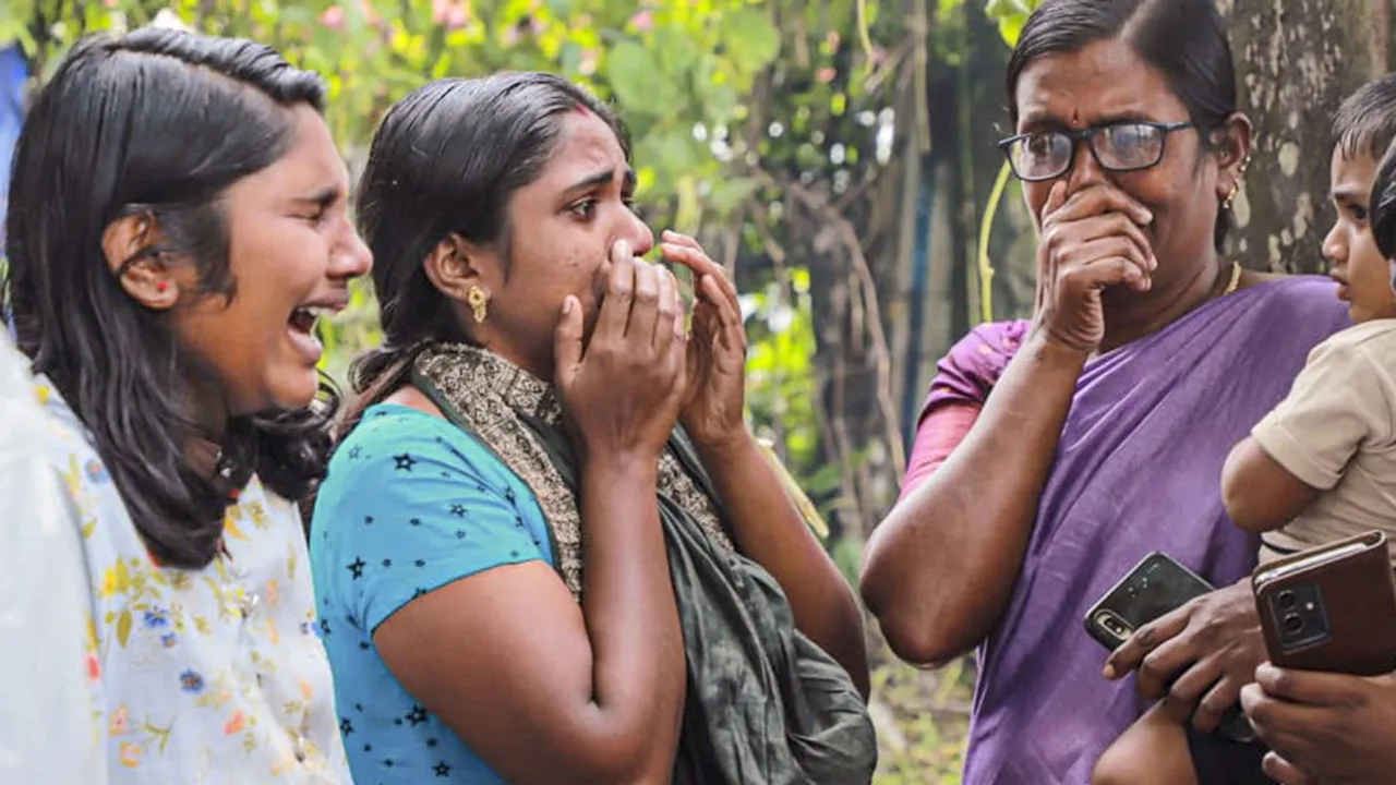 Family members and relatives of the recent landslides victims mourn at a crematorium, at Chooralmala, in Wayanad district