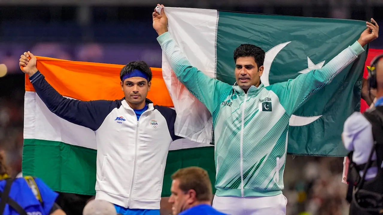 Silver medallist India's Neeraj Chopra and Gold medallist Pakistan's Arshad Nadeem celebrate after the men's javelin throw final at the 2024 Summer Olympics, in Paris, France, Thursday, Aug. 8, 2024.
