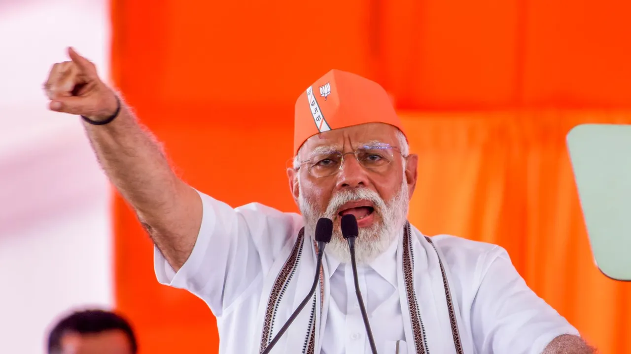 Prime Minister Narendra Modi addresses a public meeting, in Adilabad, Telangana