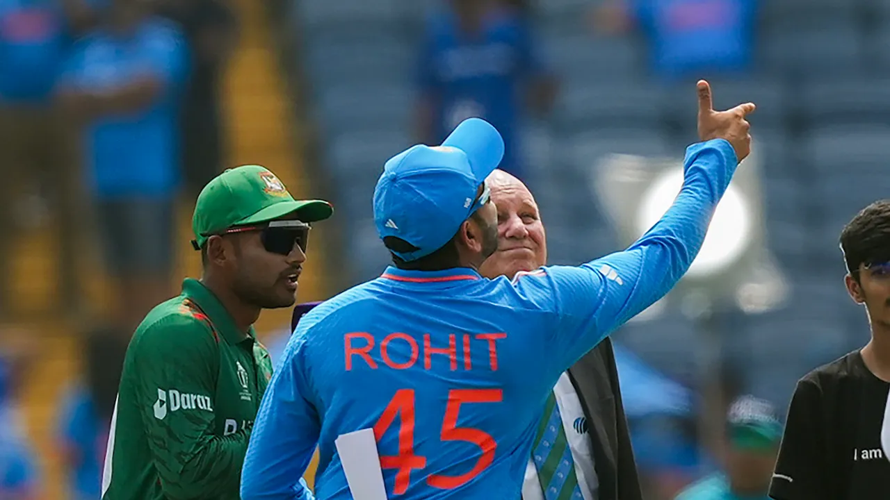 Rohit Sharma and Bangladesh's captain Najmul Hossain Shanto at the toss before the ICC Men's Cricket World Cup 2023 match between India and Bangladesh, at Maharashtra Cricket Association Stadium in Pune, Thursday, Oct. 19, 2023. 