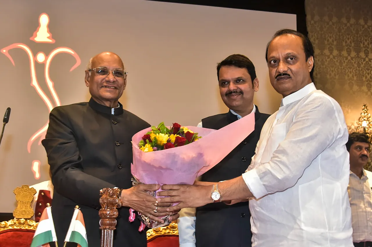 Maharashtra Governor Ramesh Bais greets the newly-sworn in Deputy Chief Minister Ajit Pawar after administering him oath of office, at Raj Bhavan