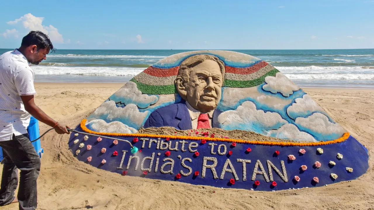 Sand artist Sudarsan Patnaik creates a sand sculpture to pay tributes to Ratan Tata at Puri beach in Odisha, Thursday, Oct. 10, 2024