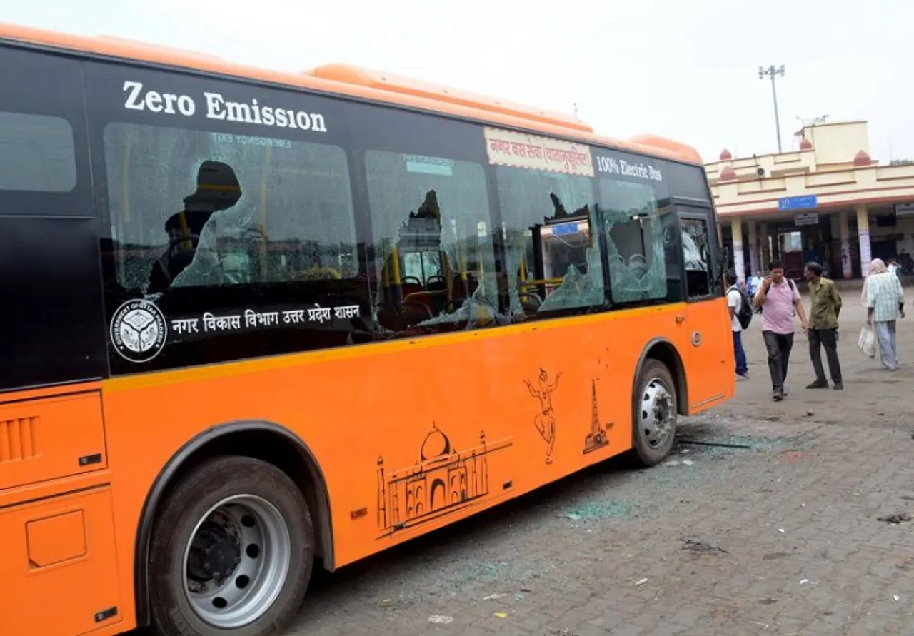 Broken windows of a bus that was vandalised by a mob in protest against Centres Agnipath scheme, in Varanasi