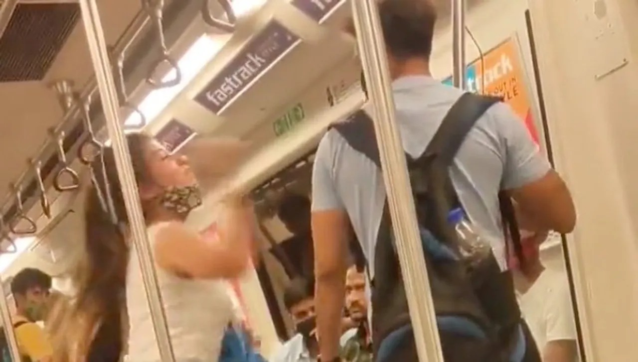 A still from the video showing woman hitting man in Delhi metro