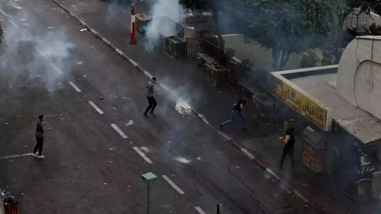 Videos posted to social media showed local youths pelting a a Palestinian military-style jeep with bricks, stones and metal bars before chasing the vehicle from the central Martyrs Square