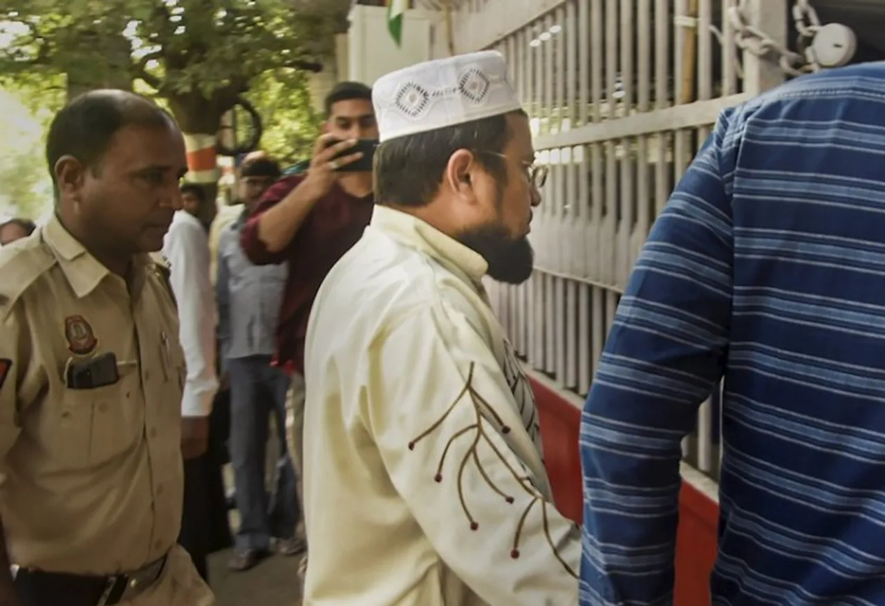 Aneesh, an accused detained during a raid by Special Cell of the Delhi Police for his alleged association with Popular Front of India (PFI), being taken to a police station, in New Delhi