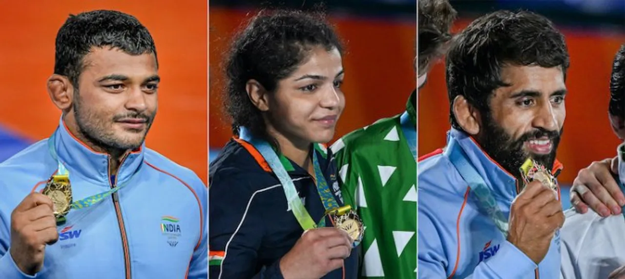 (L-R) Wrestlers Deepak Punia, Sakshi Malik and Bajrang Punia pose with their gold medals during the medal ceremony, at the Commonwealth Games 2022 (CWG), in Birmingham, UK, Friday