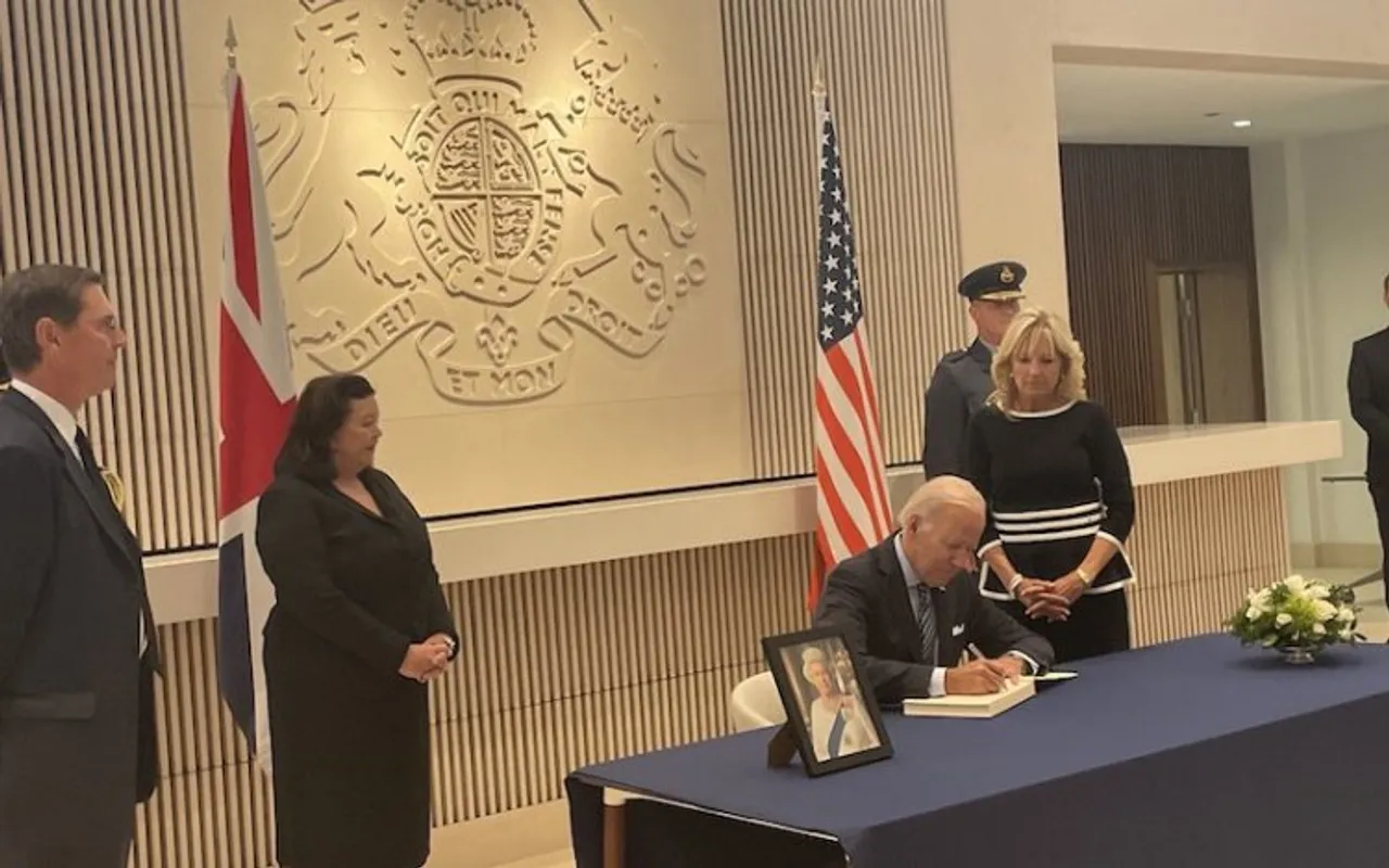 Joe Biden signs a condolence book at the British embassy in DC
